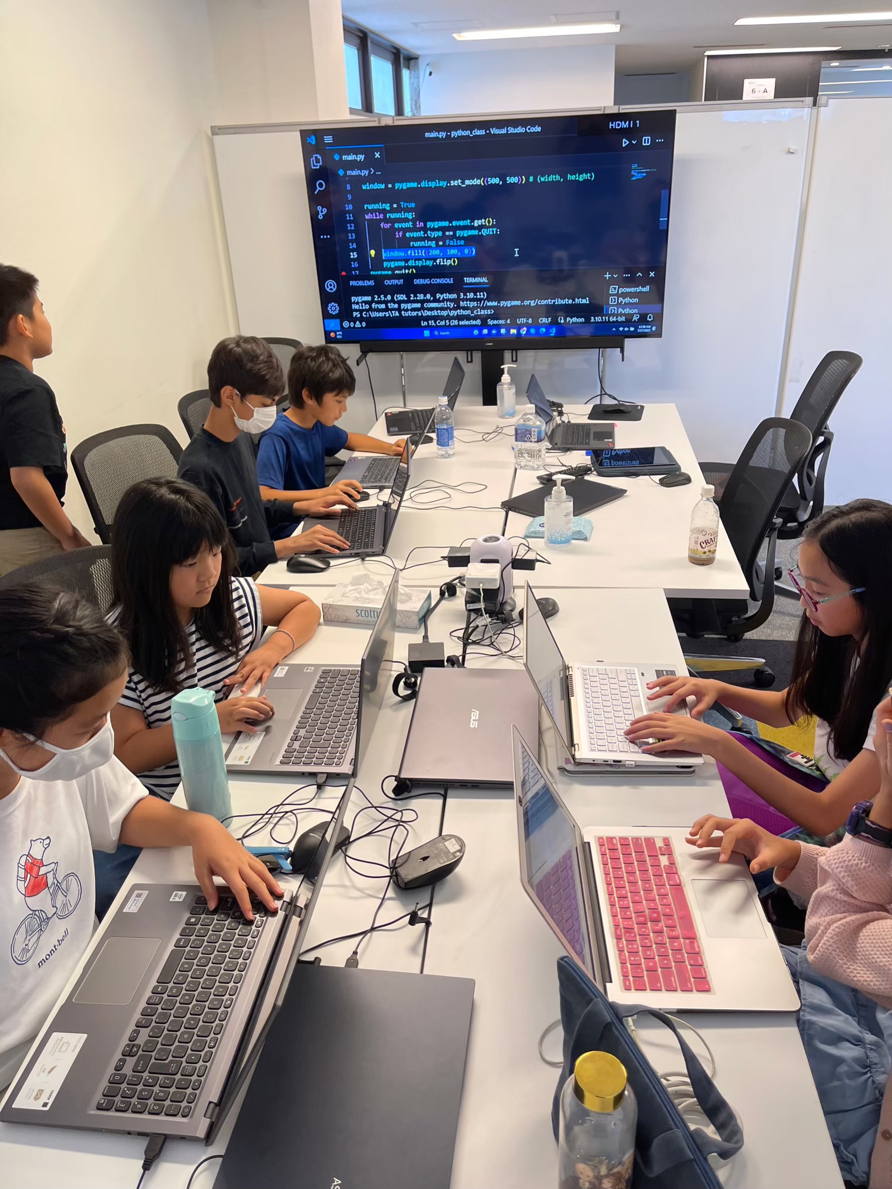 Students collaborating during a coding workshop